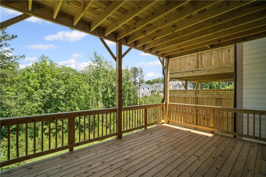 201 Retreat Lane Canton, GA 30114 - Photo 10 of 43 a view of a balcony with wooden floor