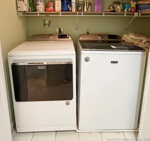a balcony with furniture and a potted plant