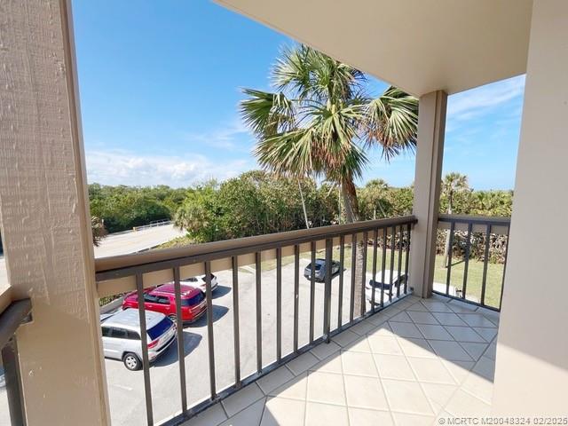 2641 Northeast Ocean Boulevard, Unit 201 Stuart, FL 34996 - Photo 23 of 34 a balcony with furniture and a potted plant