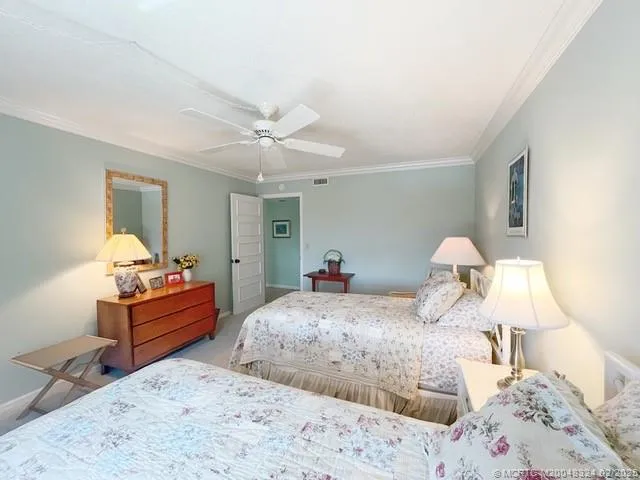 a spacious bathroom with a double vanity sink and mirror