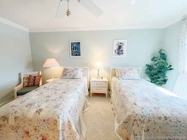 2641 Northeast Ocean Boulevard, Unit 201 Stuart, FL 34996 - Photo 29 of 34 a bedroom with a bed and a couch