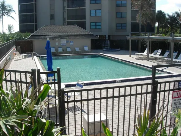 a view of a chairs and table in the patio