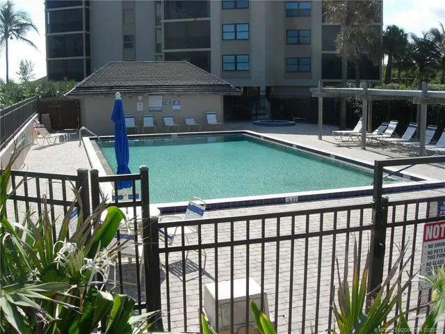 a view of a chairs and table in the patio