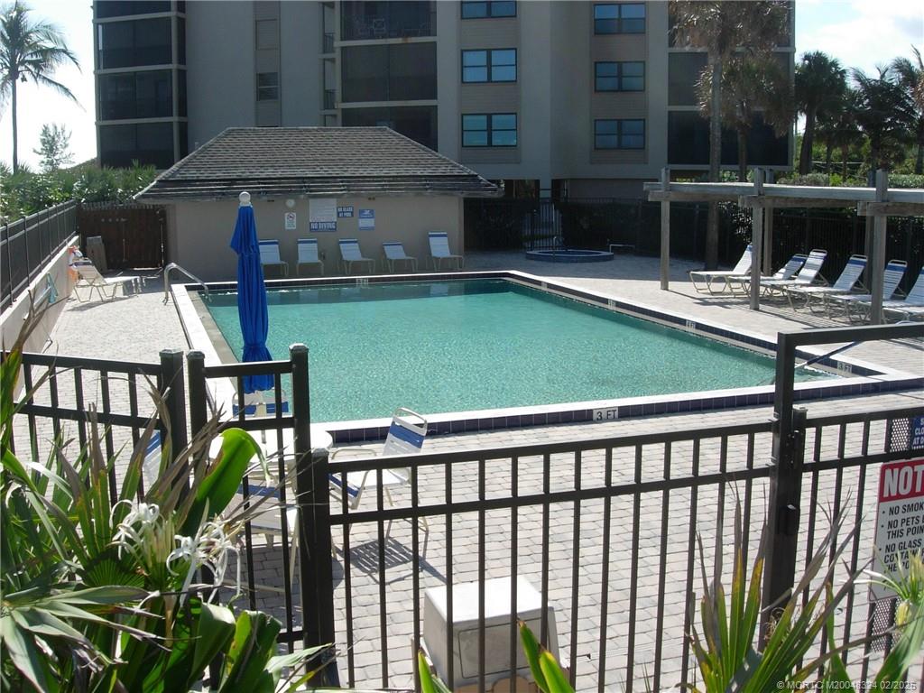 2641 Northeast Ocean Boulevard, Unit 201 Stuart, FL 34996 - Photo 4 of 34 a view of a chairs and table in the patio