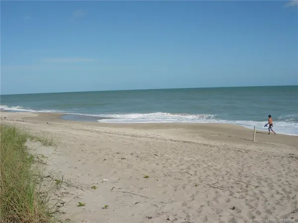 a view of a refrigerator in the middle of a yard