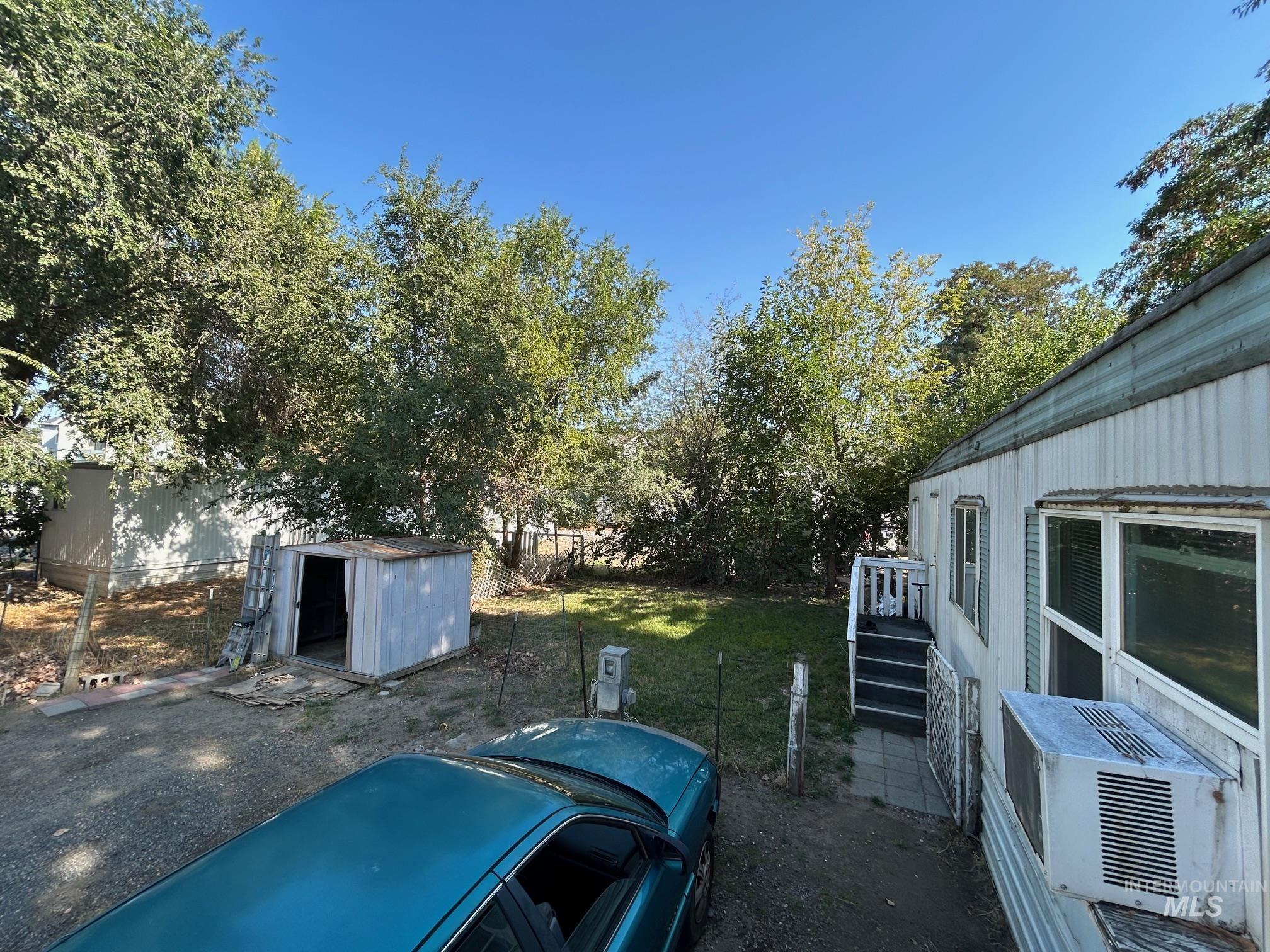 1383 Fair Street, Unit 5 Clarkston, WA 99403 - Photo 6 of 16 View of yard with a storage shed and cooling unit