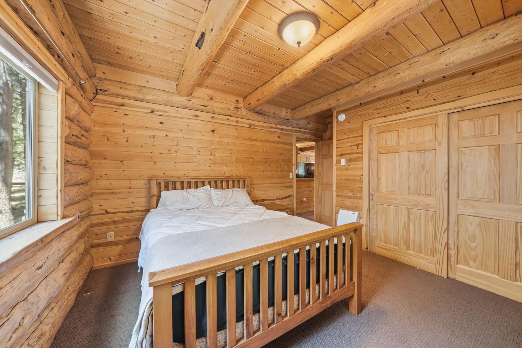 14177 Whitewater Loop La Pine, OR 97739 - Photo 11 of 38 a bedroom with a bed and a window