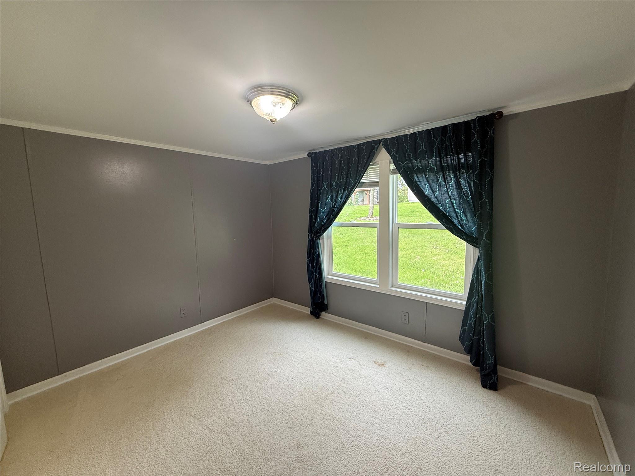 7149-7163 Burpee Road Grand Blanc, MI 48439 - Photo 19 of 72 Unfurnished room featuring light colored carpet and crown molding