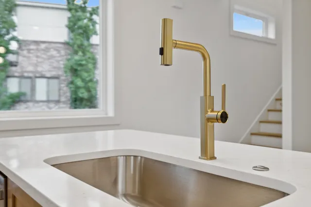 a view of a room with a mirror and a fan