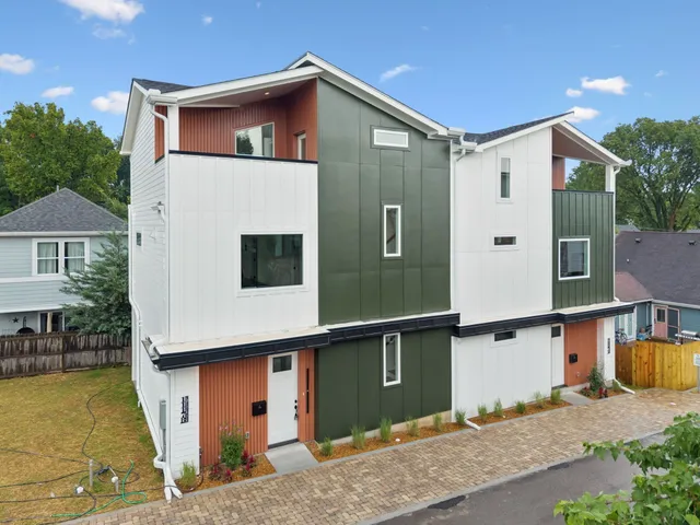 an aerial view of a house with a big yard