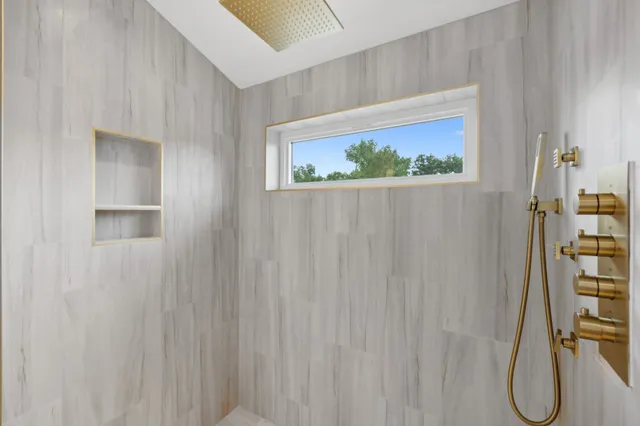 a view of a bathroom with a shower curtain