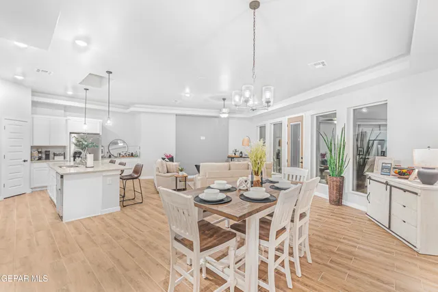 a living room with furniture and kitchen view