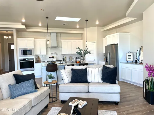 a view of a room with wooden floor and potted plant