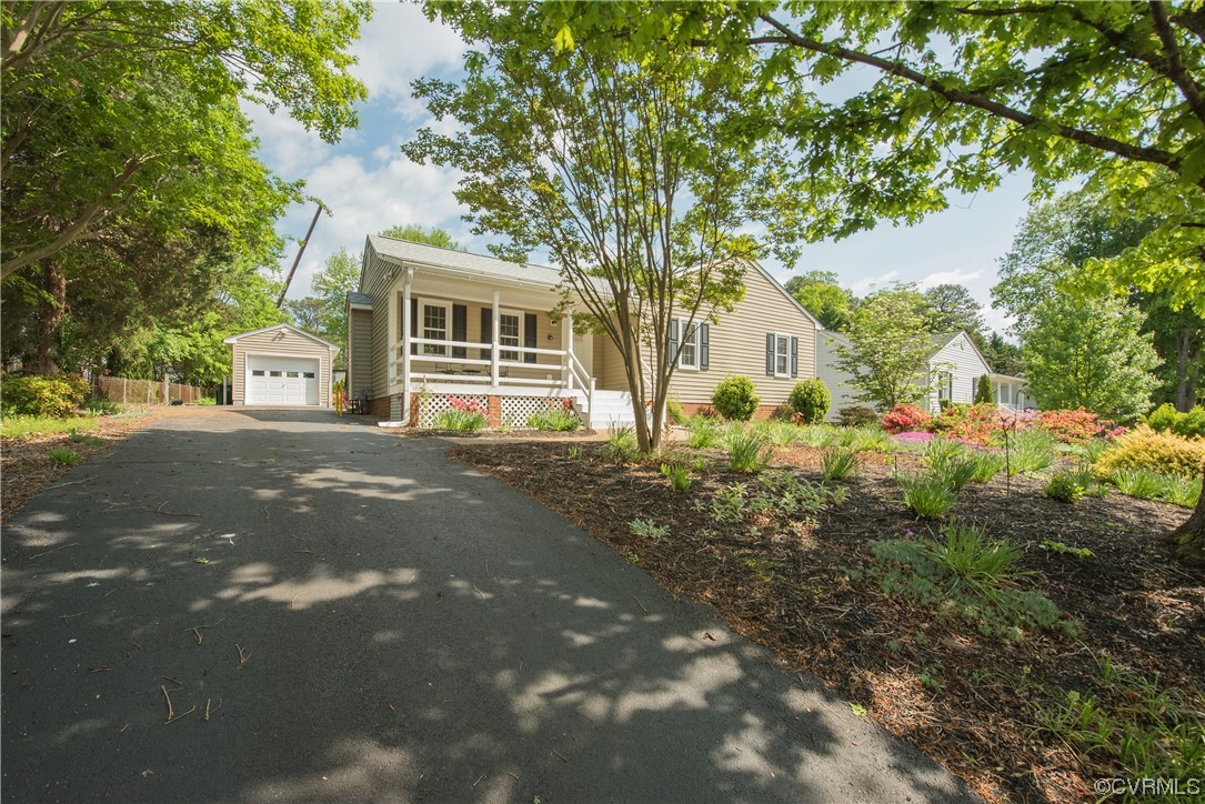 7508 Donder Road Richmond, VA 23294 - Photo 1 of 38 a front view of a house with a garden