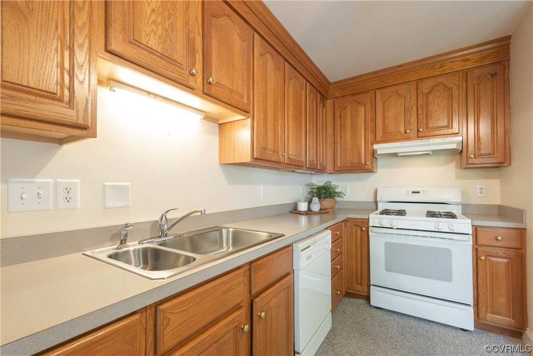 7508 Donder Road Richmond, VA 23294 - Photo 11 of 38 a kitchen with cabinets appliances a sink and a counter space