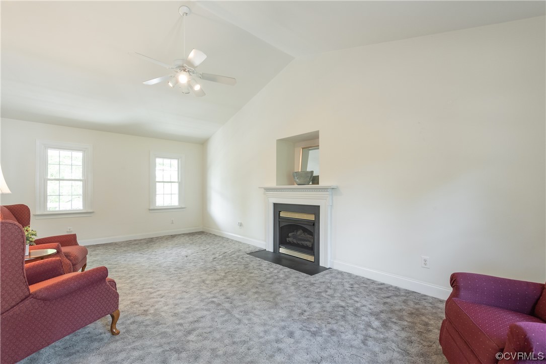 7508 Donder Road Richmond, VA 23294 - Photo 14 of 38 a living room with furniture a fireplace and a window