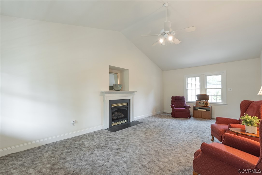 7508 Donder Road Richmond, VA 23294 - Photo 16 of 38 a living room with furniture and a fireplace