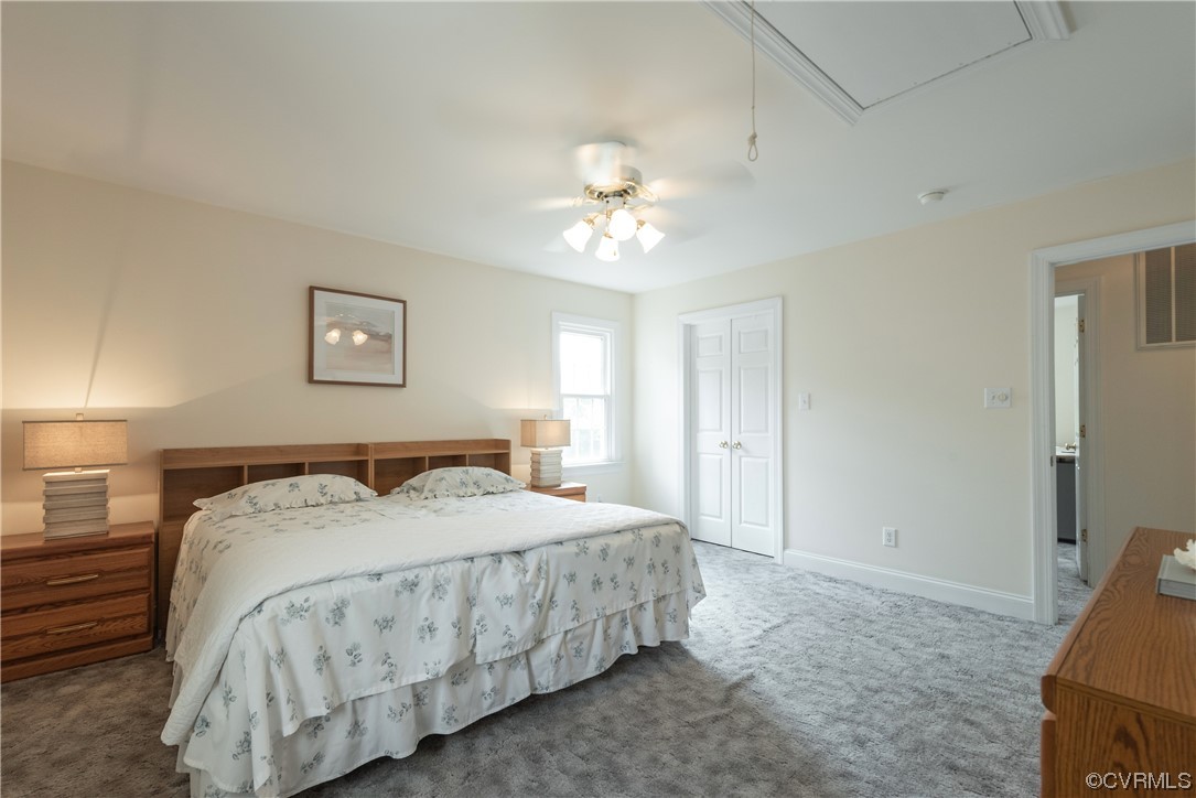 7508 Donder Road Richmond, VA 23294 - Photo 24 of 38 a bedroom with a bed and a chandelier