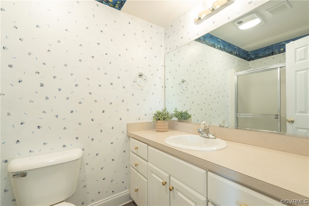 7508 Donder Road Richmond, VA 23294 - Photo 25 of 38 a bathroom with a sink toilet and shower