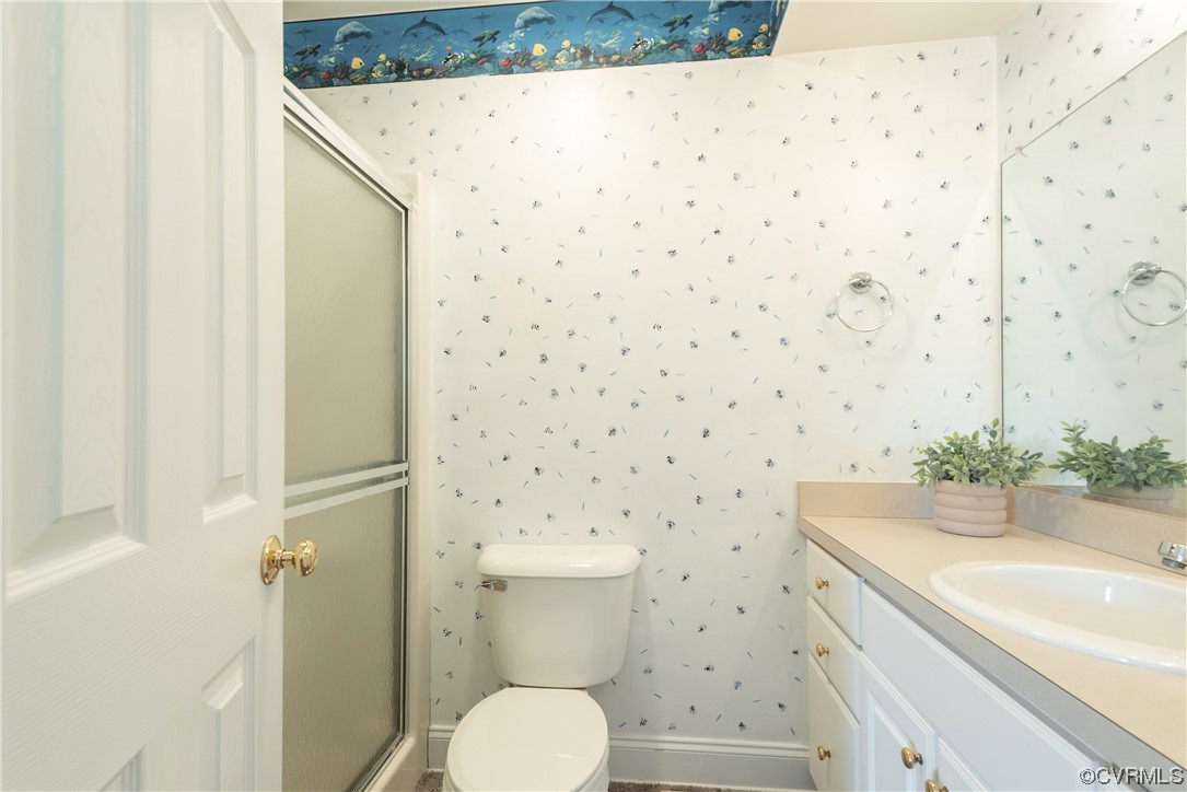 7508 Donder Road Richmond, VA 23294 - Photo 26 of 38 a bathroom with a sink toilet and shower