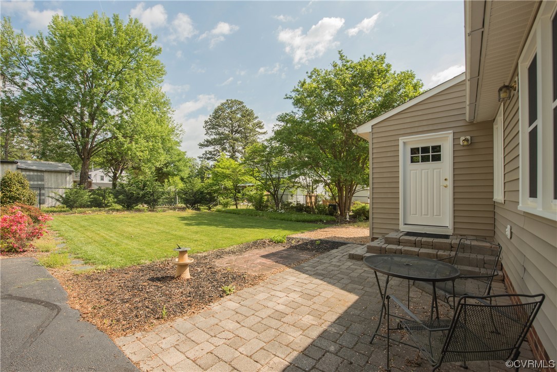 7508 Donder Road Richmond, VA 23294 - Photo 34 of 38 a view of a house with backyard and a tree