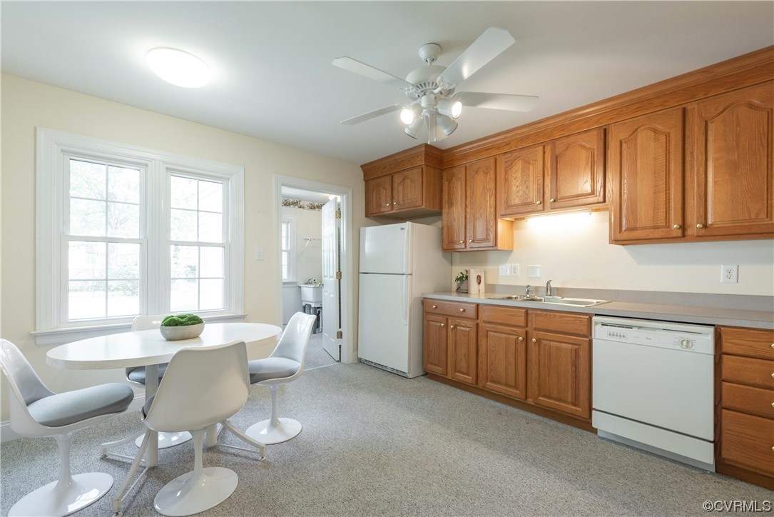 7508 Donder Road Richmond, VA 23294 - Photo 6 of 38 a kitchen with stainless steel appliances granite countertop a sink a stove a dining table and chairs