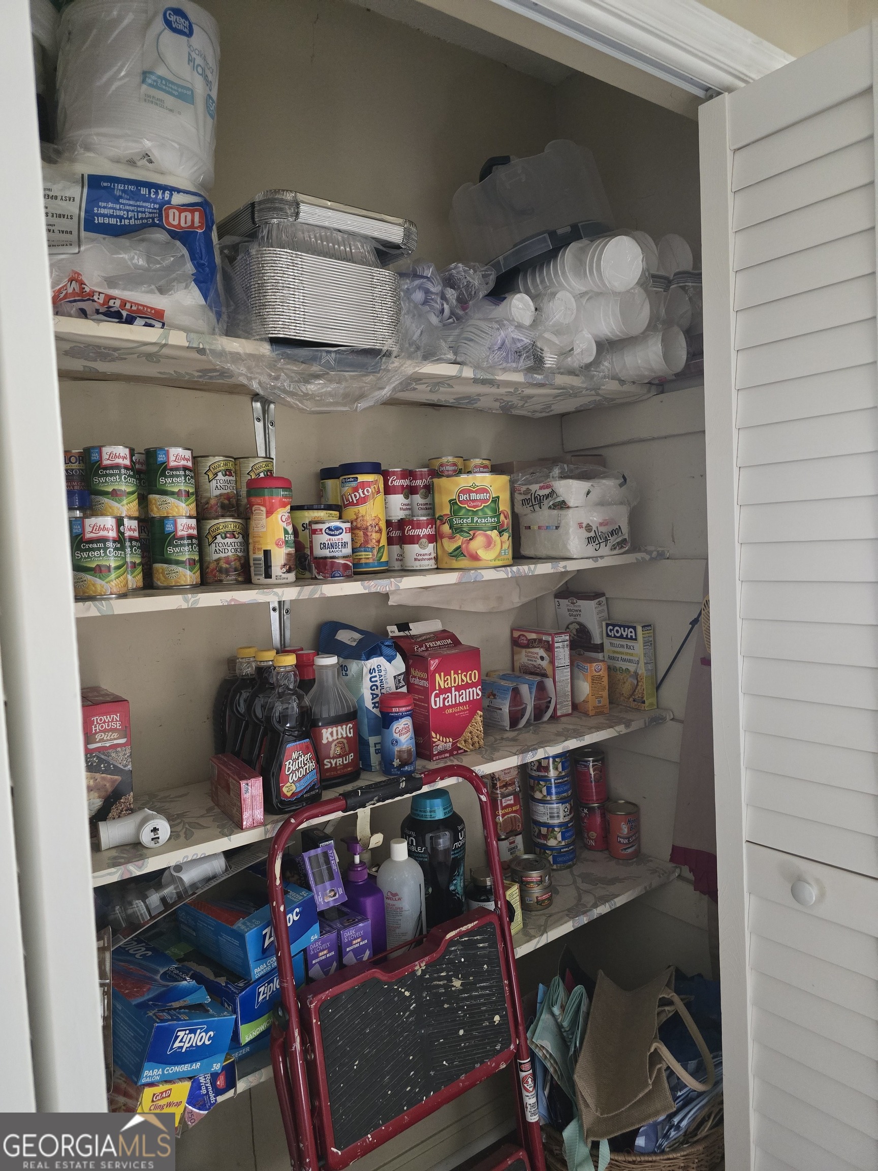 479 Mitchell Loop Bluffton, GA 39824 - Photo 14 of 51 a room with lots of different colored cloths