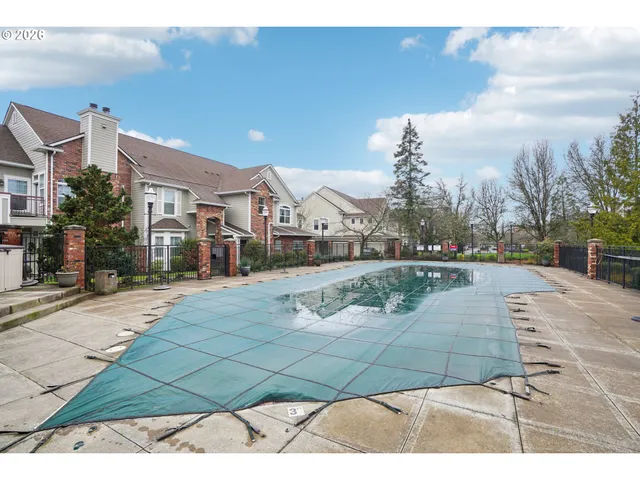 a view of a street with houses on both side