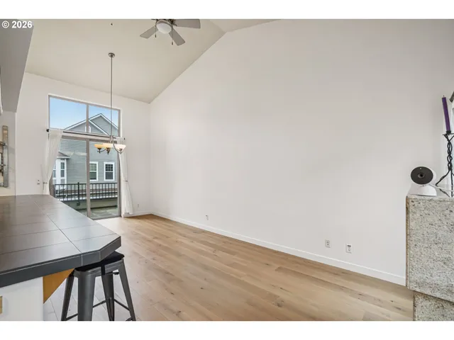a view of a room with furniture and wooden floor