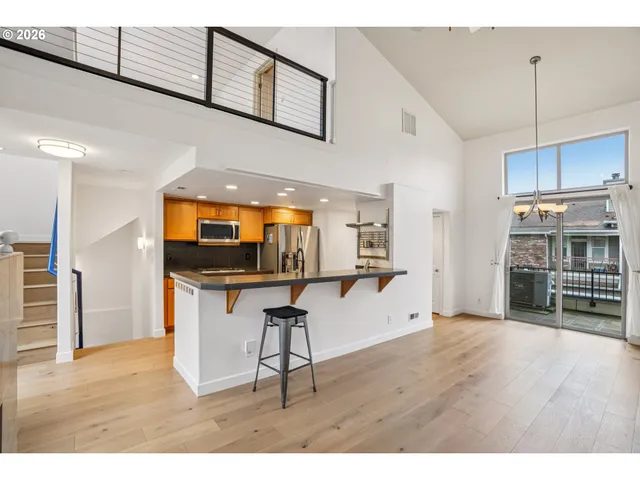 a view of kitchen with furniture and wooden floor