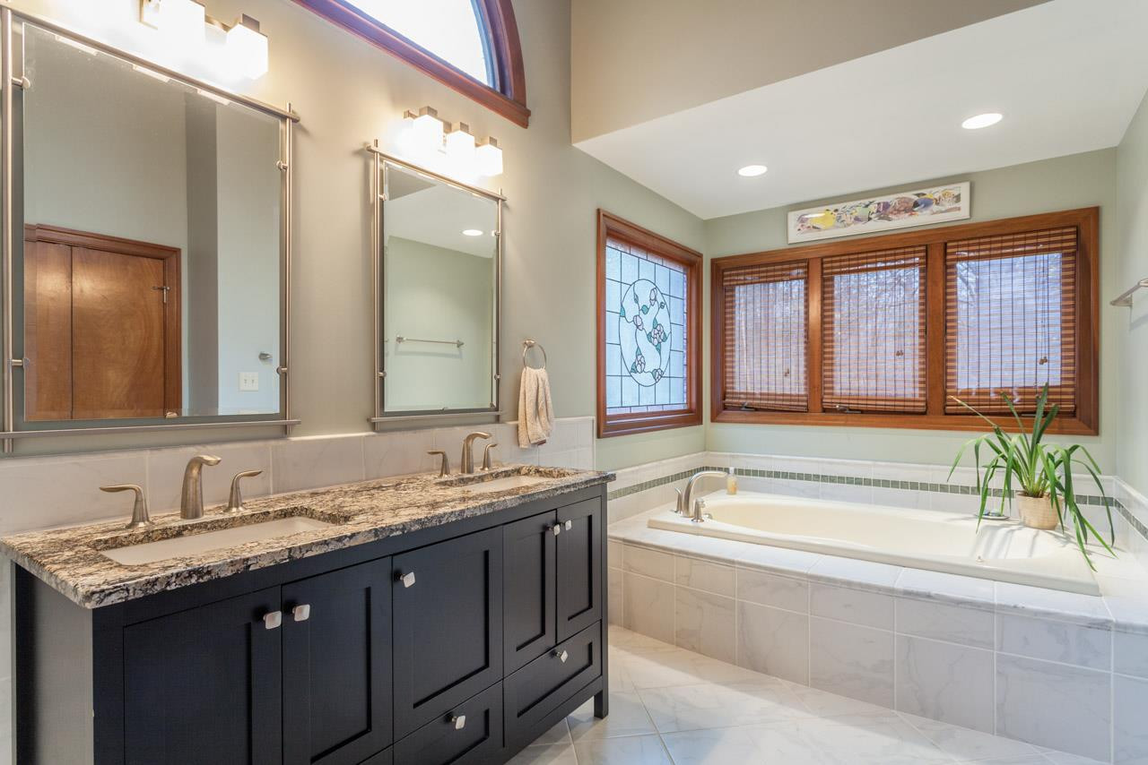 10100 Ethridge Court Raleigh, NC 27615 - Photo 14 of 25 Remodeled with dual granite vanity & walk-in shower Master Bath