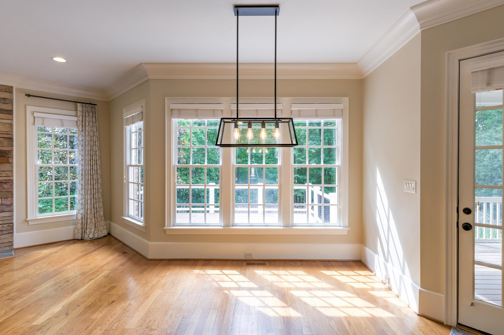 1417 Caistor Lane Raleigh, NC 27614 - Photo 13 of 42 Eat-in area is flooded w natural light and offers access to screened porch and TWO tier composite decks (no staining or warping- low maintenance!)