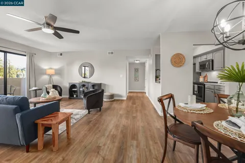 a living room with furniture and a clock