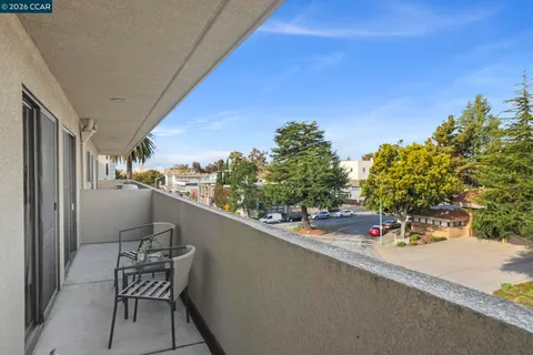 a view of a balcony with chairs