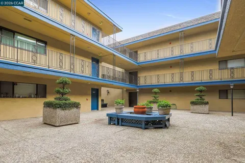 a front view of a building with parking