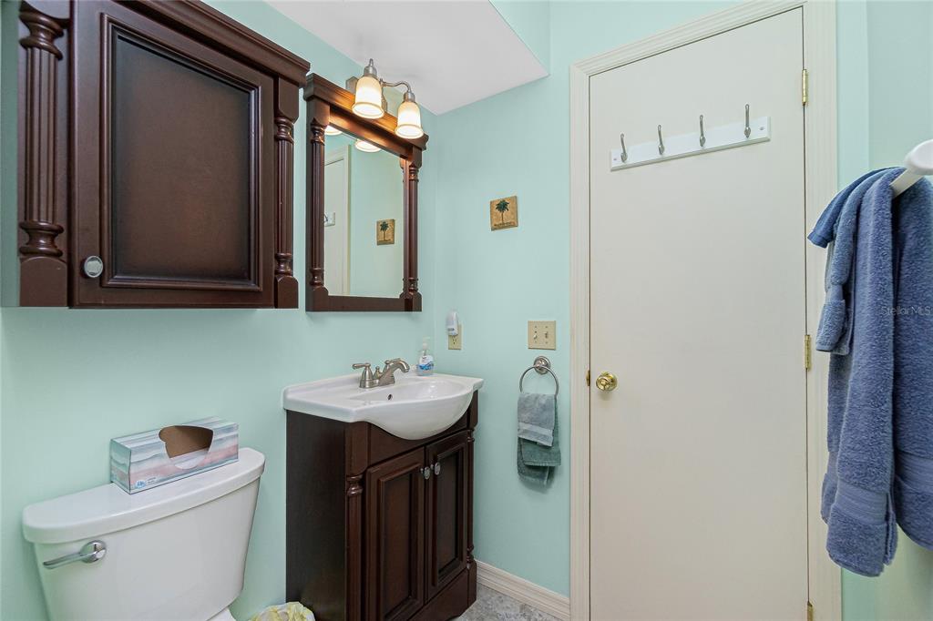 2450 North Beach Road, Unit 231 Englewood, FL 34223 - Photo 23 of 54 a bathroom with a sink toilet and mirror