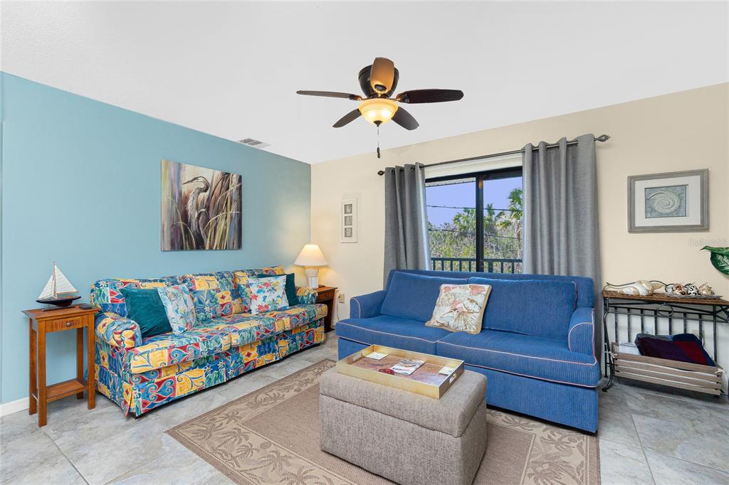 2450 North Beach Road, Unit 231 Englewood, FL 34223 - Photo 6 of 54 a living room with furniture and a window
