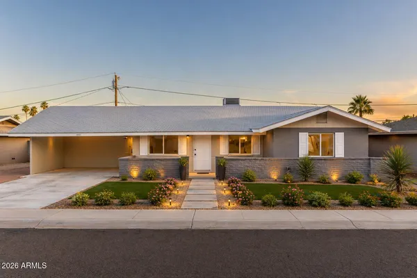 a front view of a house with a garage