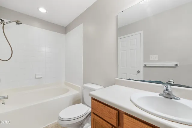 a bathroom with a sink vanity and a mirror