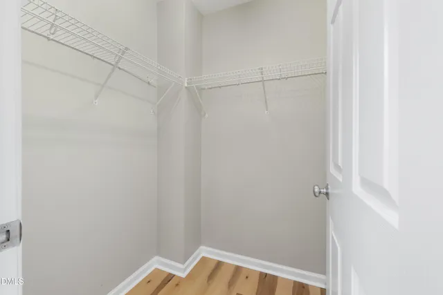 a bathroom with a bath tub with a shower