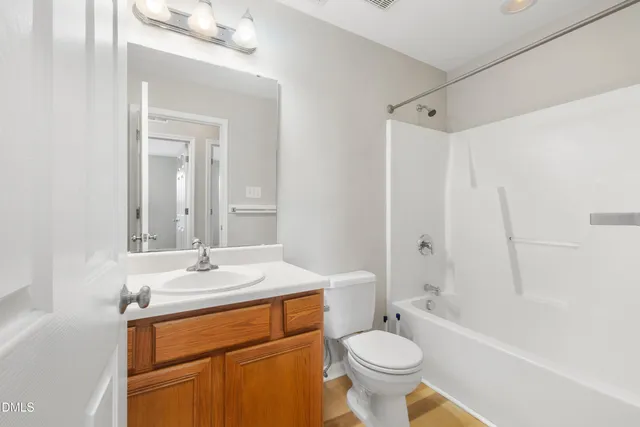 a view of wooden floor and windows in a room