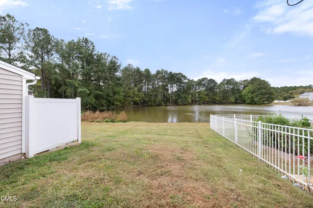a view of room with wooden floor