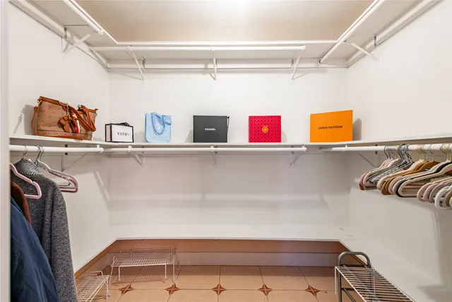 a bathroom with a double vanity sink a mirror and a bathtub