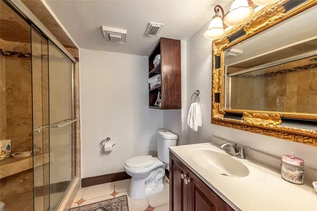 a bedroom with a bed and a dresser in it