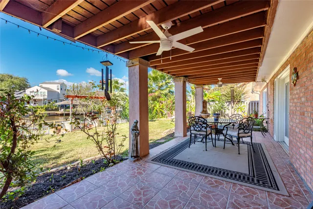a patio with a yard table and chairs
