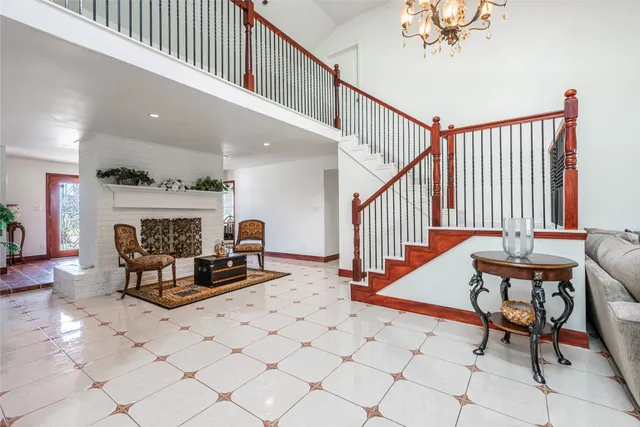 a view of living room with furniture and a chandelier