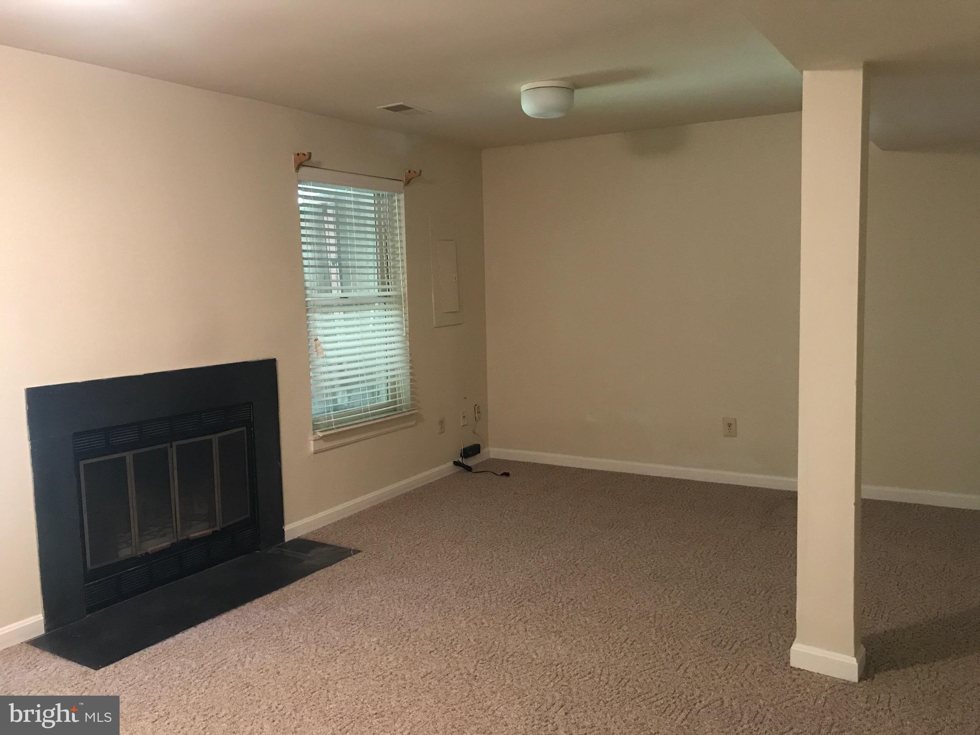 6249 Rathlin Drive Springfield, VA 22152 - Photo 25 of 38 Walk out bsmt. Family room with wood burning FP
