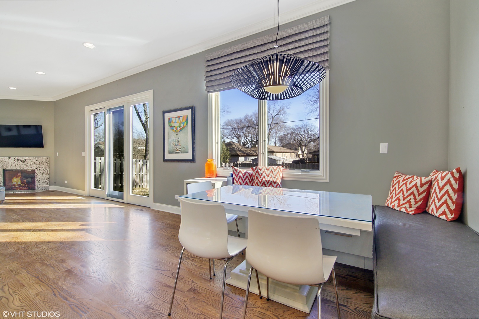 435 Ridge Road Highland Park, IL 60035 - Photo 8 of 30 a view of a dining room with furniture wooden floor and a flat screen tv