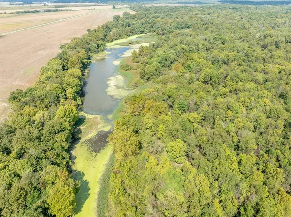 a view of a lake with a yard