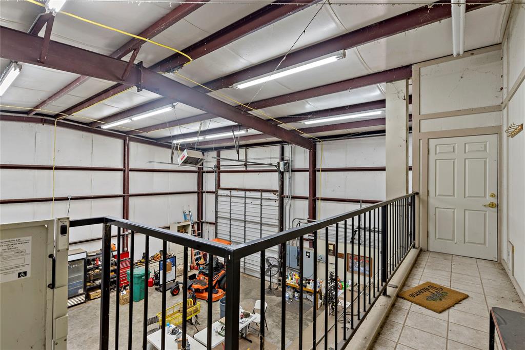 0 Fm 410 Detroit, TX 75436 - Photo 25 of 40 a view of staircase with lots of frames on wall